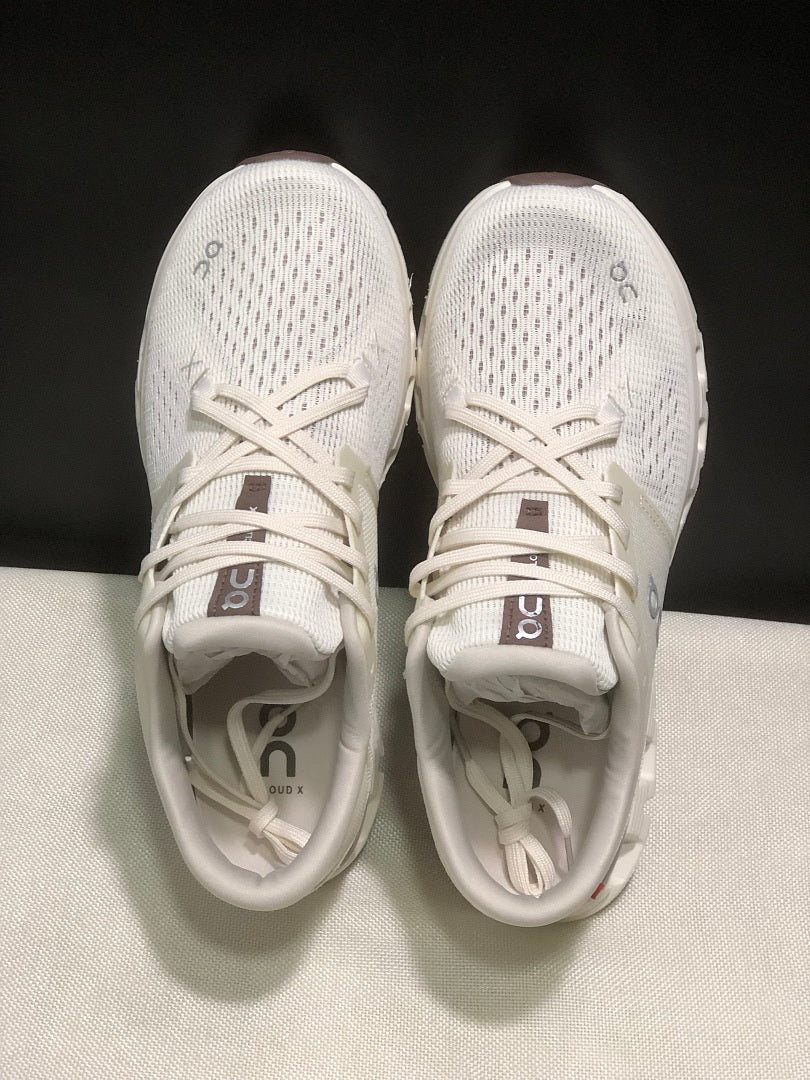 On Cloud X 4 Running Sneakers in Ivory - product image from the listing.