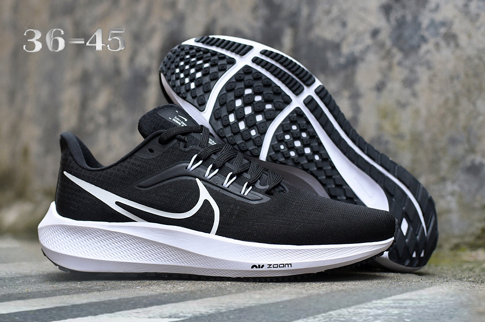 Nike Road Shoes for Running in Light Gray with Orange Swoosh - product image from the listing.