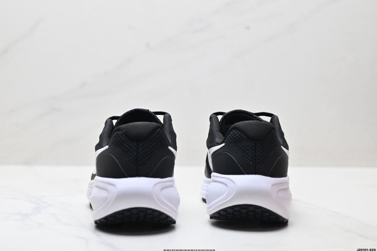 Nike Revolution 8 Running Sneakers in Black and White - product image from the listing.