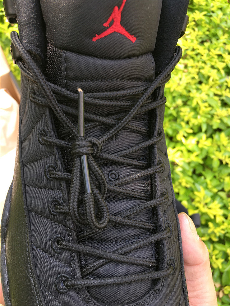 Air Jordan 12 Black Nylon High-Top Sneakers - product image from the listing.