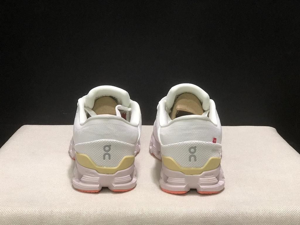 On Cloud X 4 Sneakers in White Yellow Pink - product image from the listing.