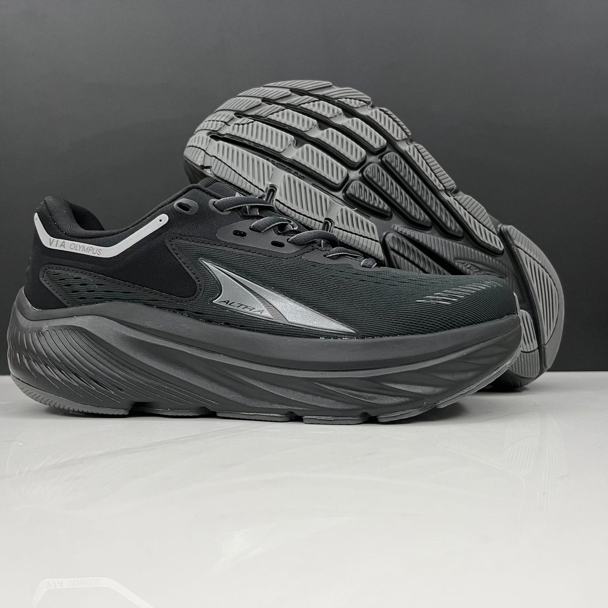 Altra Via Olympus Running Sneakers in Black - product image from the listing.