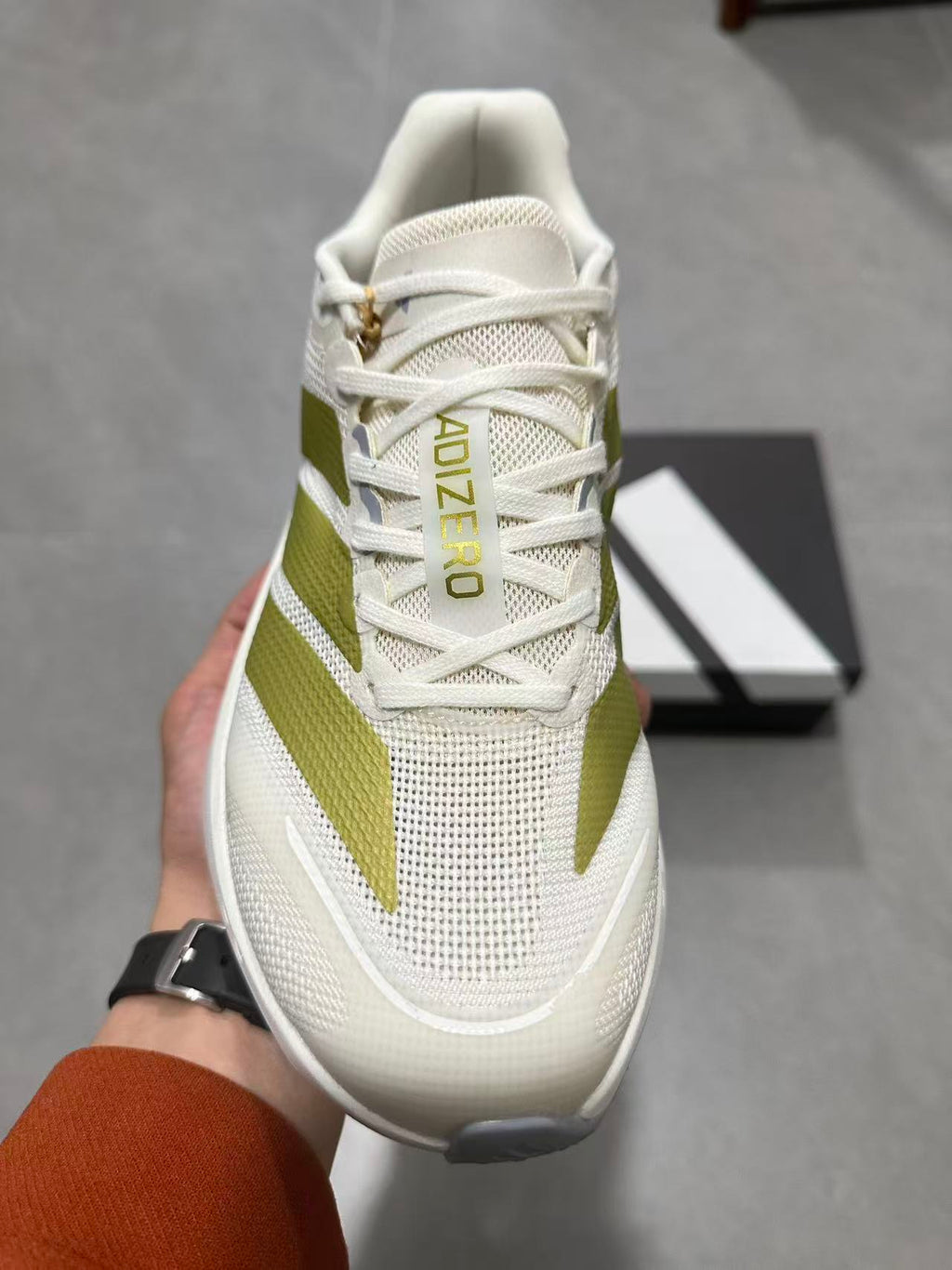 Adizero Lightstrike Pro Running Shoes in White and Olive JS4947 - product image from the listing.