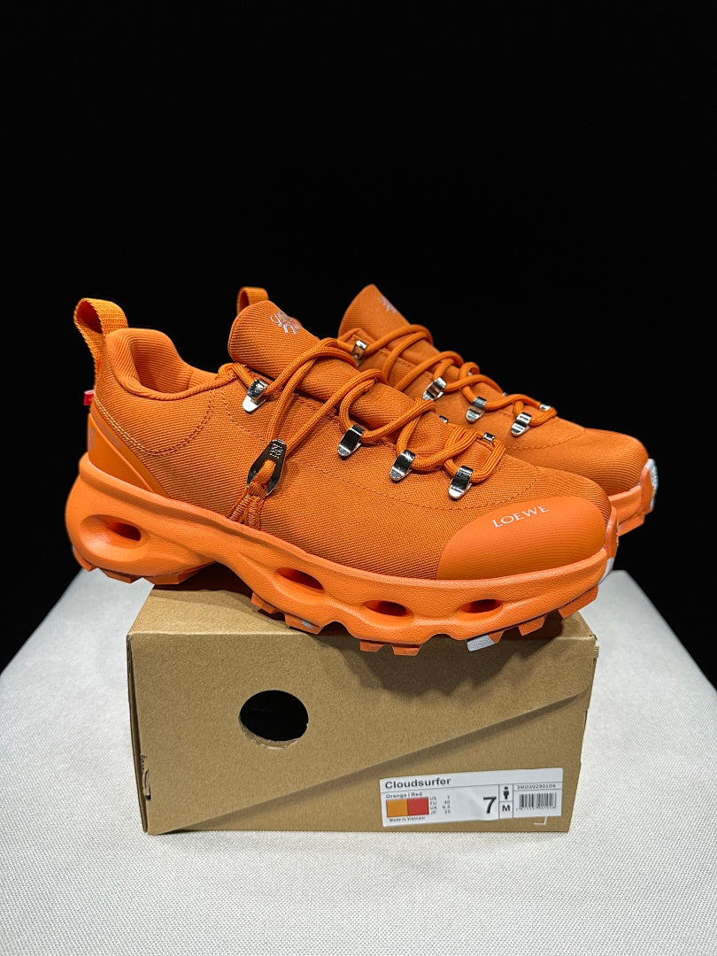 On x Loewe Cloudsurfer Orange Trail Trainers - product image from the listing.