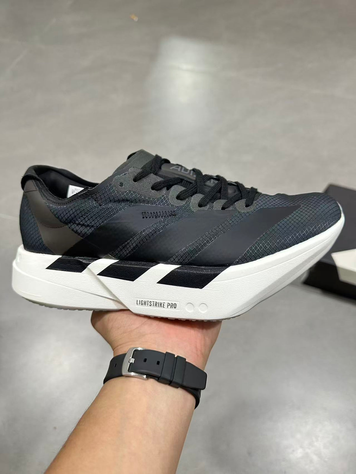 adidas Lightstrike Pro Running Shoes in Black Gray - product image from the listing.