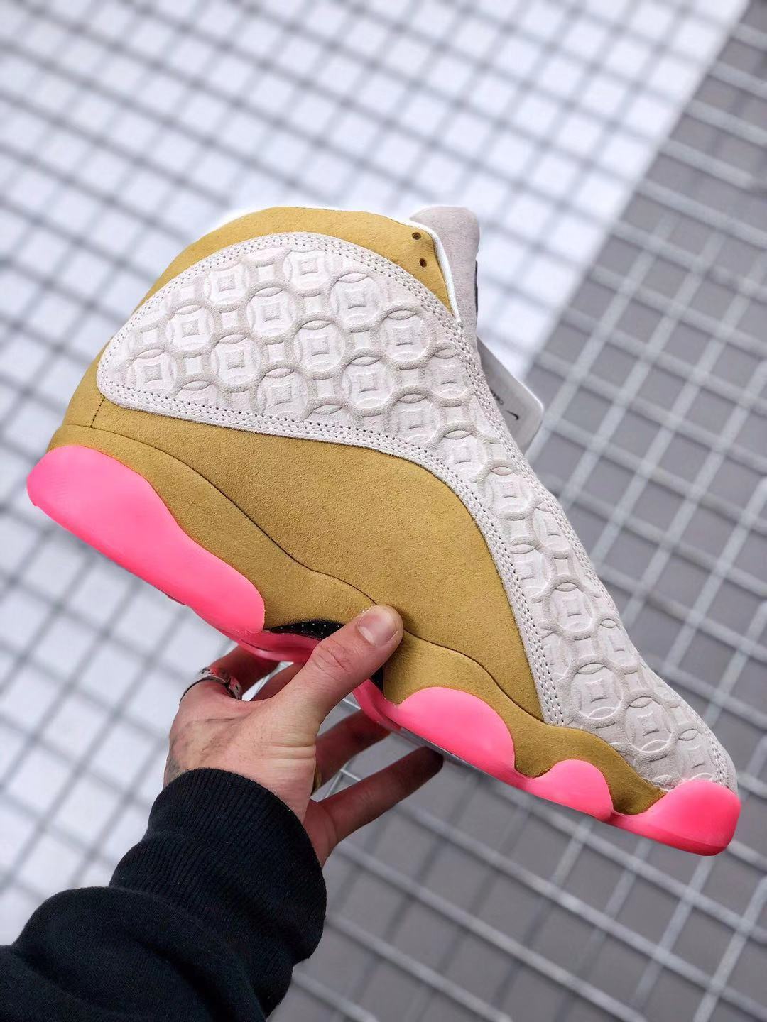 Air Jordan 13 CNY Sneakers in White, in Gold and Pink - product image from the listing.