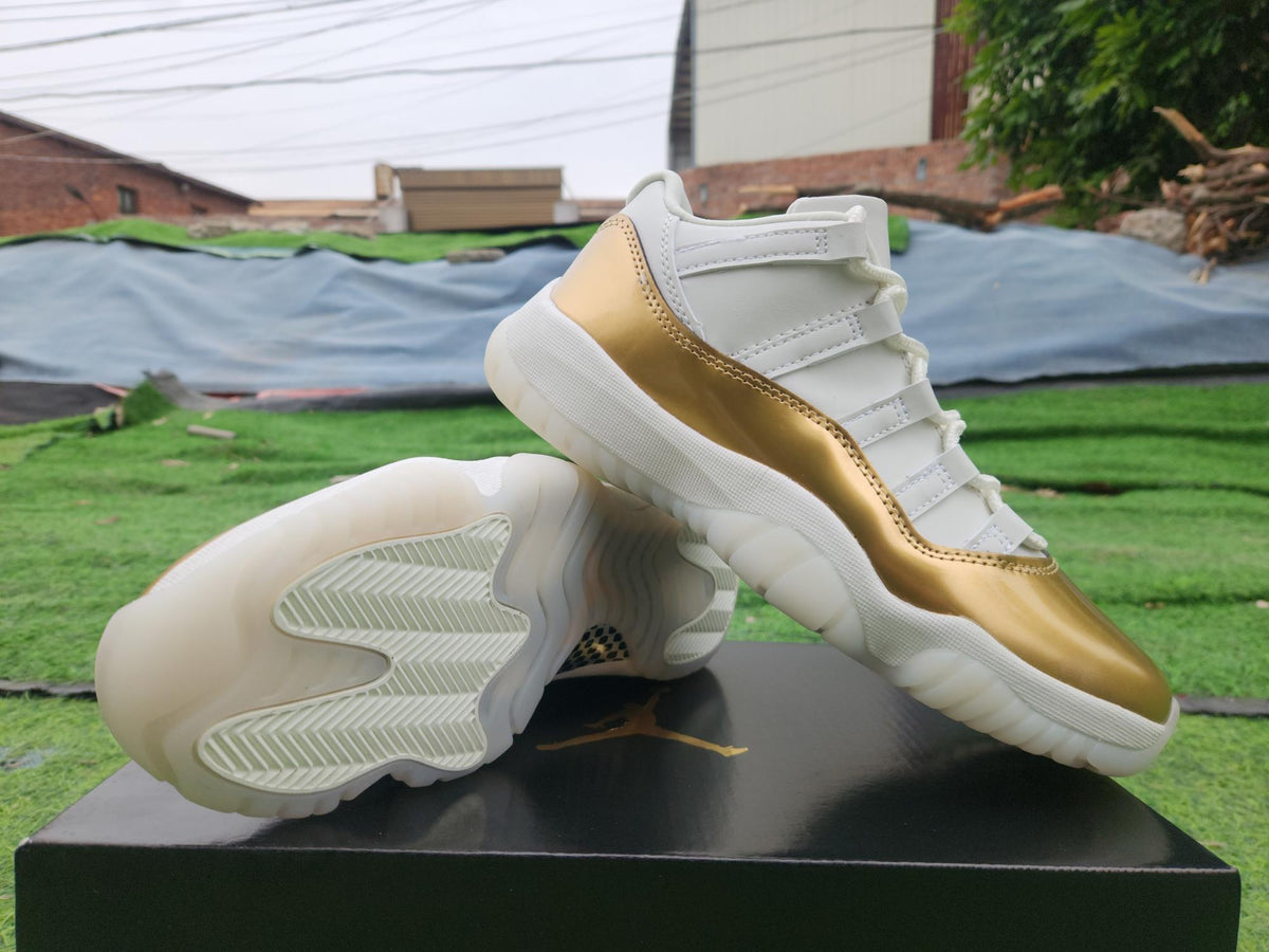 Air Jordan 11 Low in White/Gold - product image from the listing.