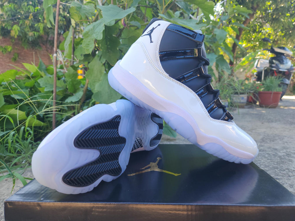 Air Jordan 11 Retro in White/Black - product image from the listing.