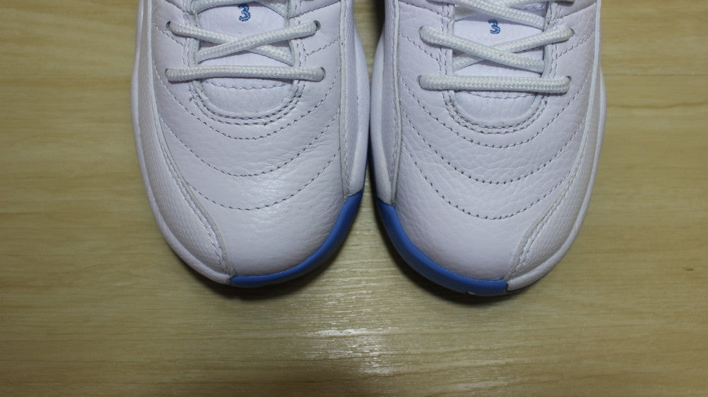 Air Jordan 12 High-Top Sneakers in University Blue 510815-127 - product image from the listing.