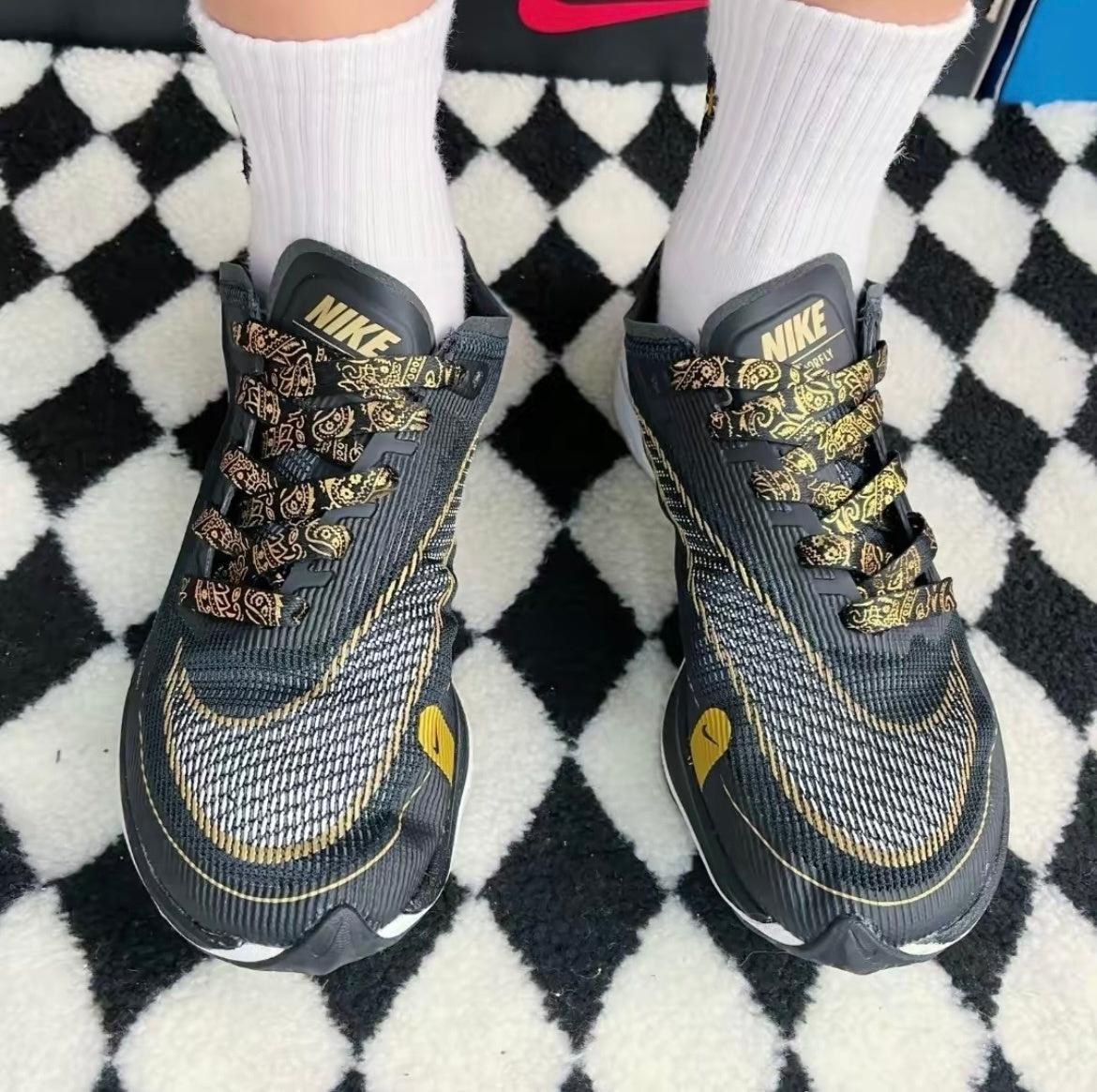 Nike ZoomX Vaporfly NEXT% 2 Running Shoes in Black Gold CU4111-001 - product image from the listing.