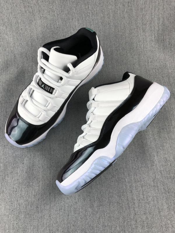 White and Black Jordan 11 Low Sneakers - product image from the listing.