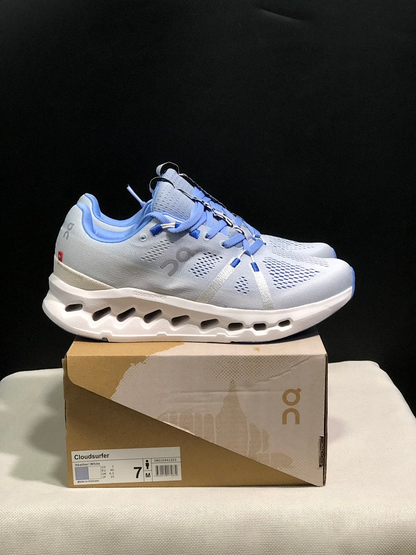 On Cloudsurfer Running Shoes, Heather in White and Blue - product image from the listing.