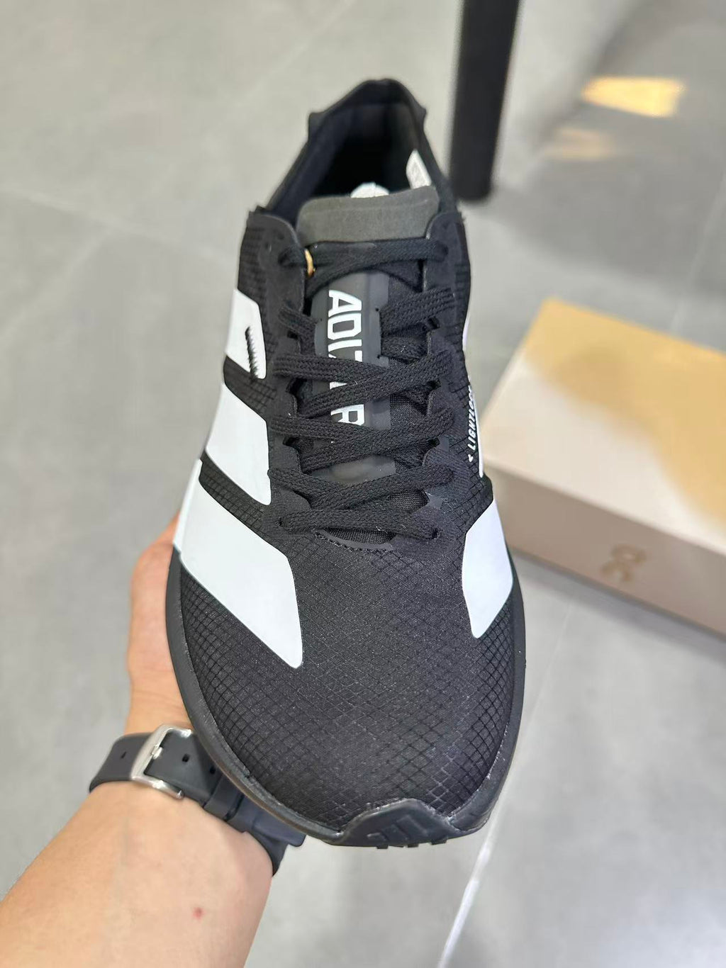 Nike Lightstrike Pro Running Shoes, in Black and White JR44798 - product image from the listing.
