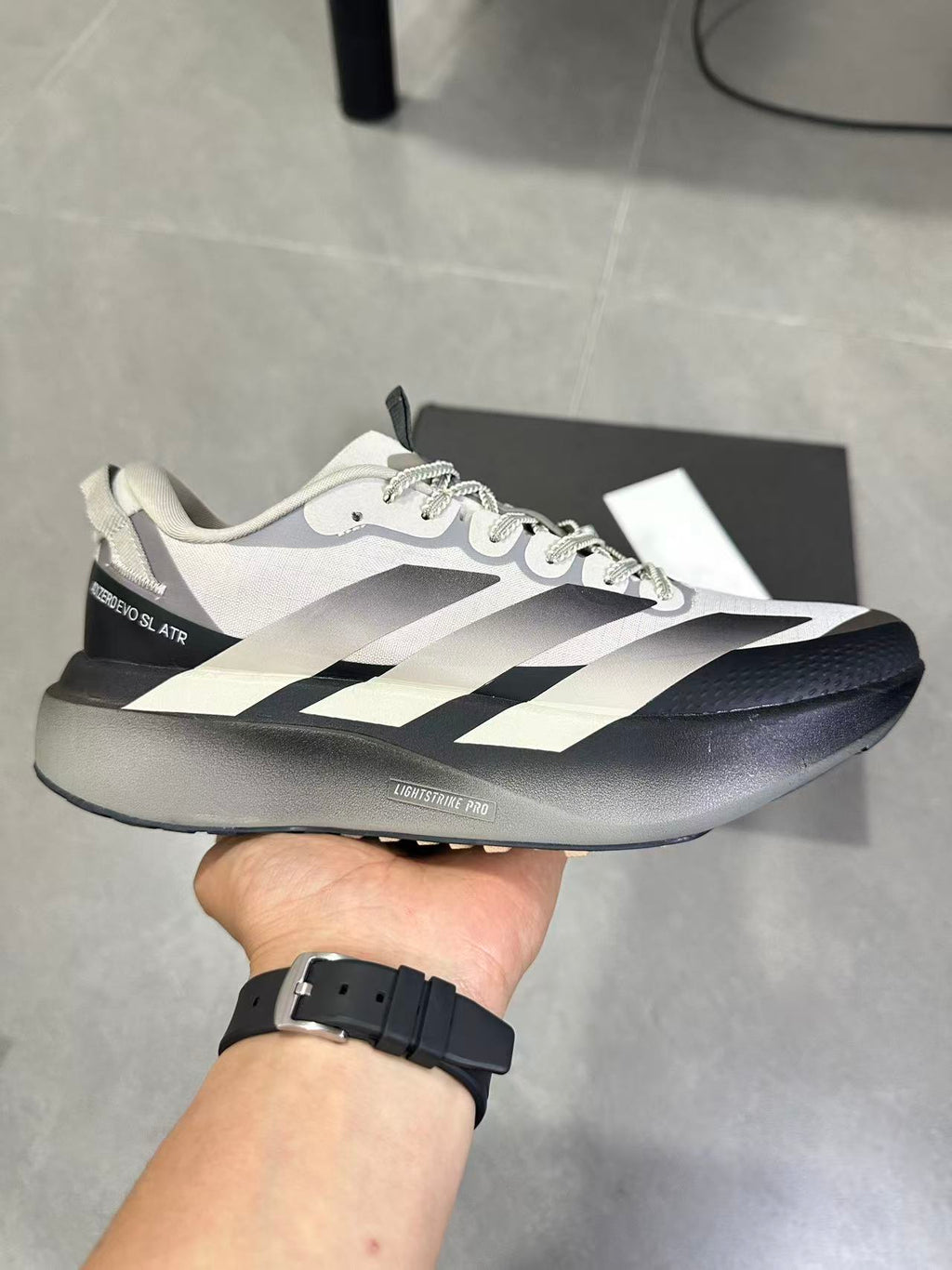 Adizero SL ATR Running Shoes in Black Brown KK0309 - product image from the listing.