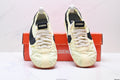 Pale Yellow and Black Nike x Jacquemus Sneakers - product image from the listing.