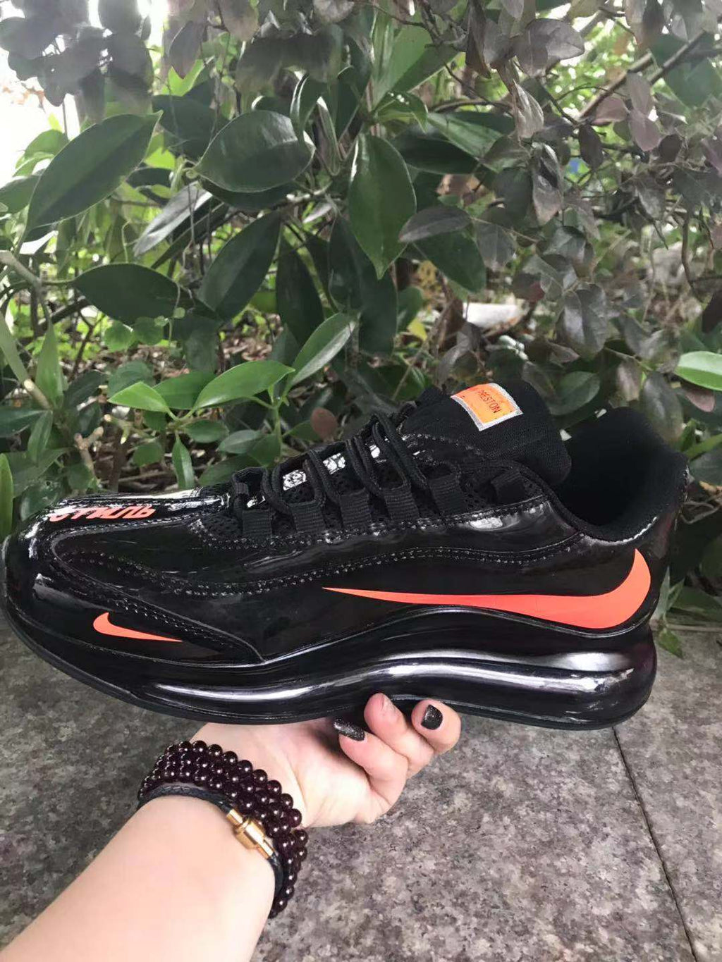 Nike Air Max 720 Sneakers in Black and Bright Orange - product image from the listing.