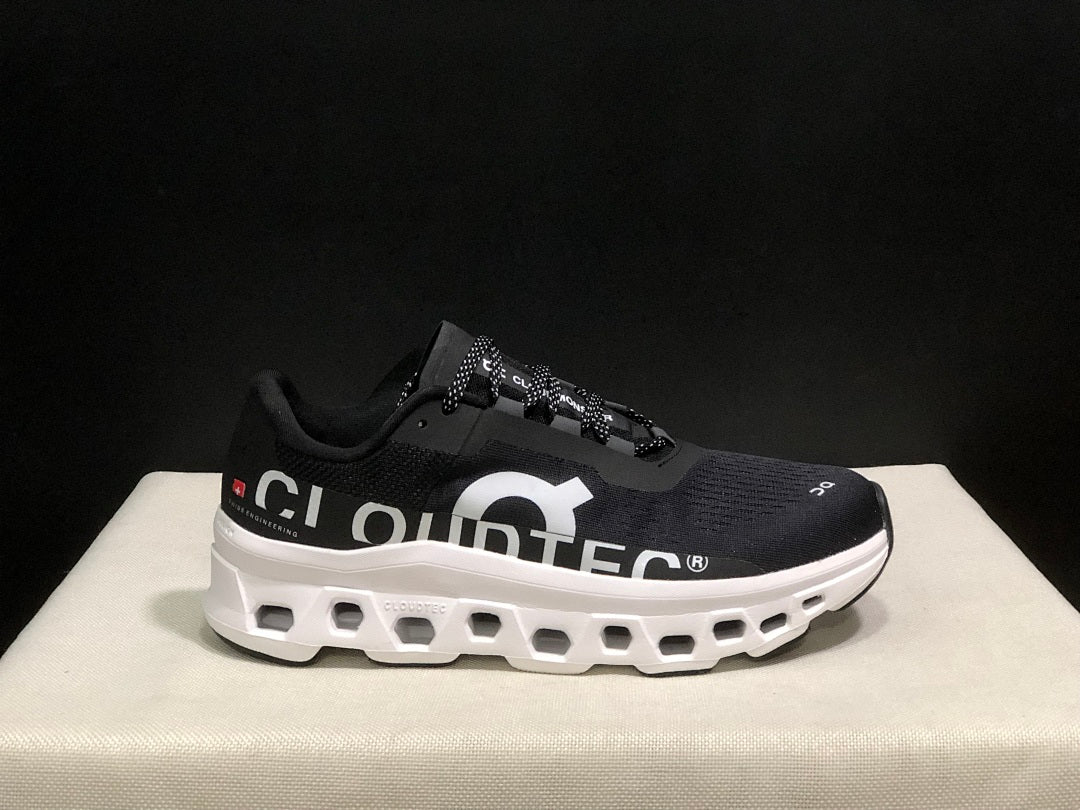 On Cloudmonster Running Sneakers in Black and White - product image from the listing.