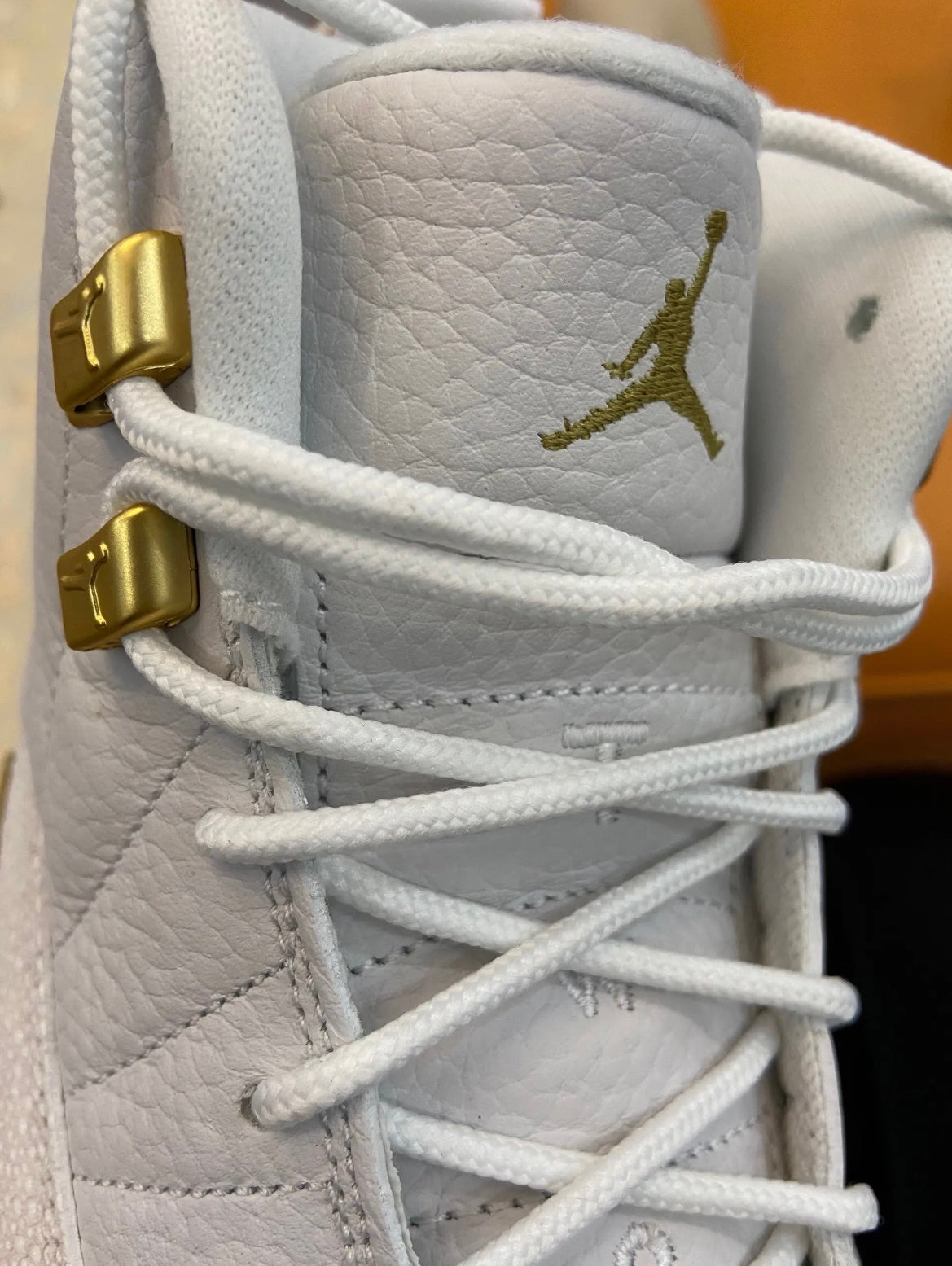 Air Jordan 12 OVO Sneakers in White 873864-102 - product image from the listing.