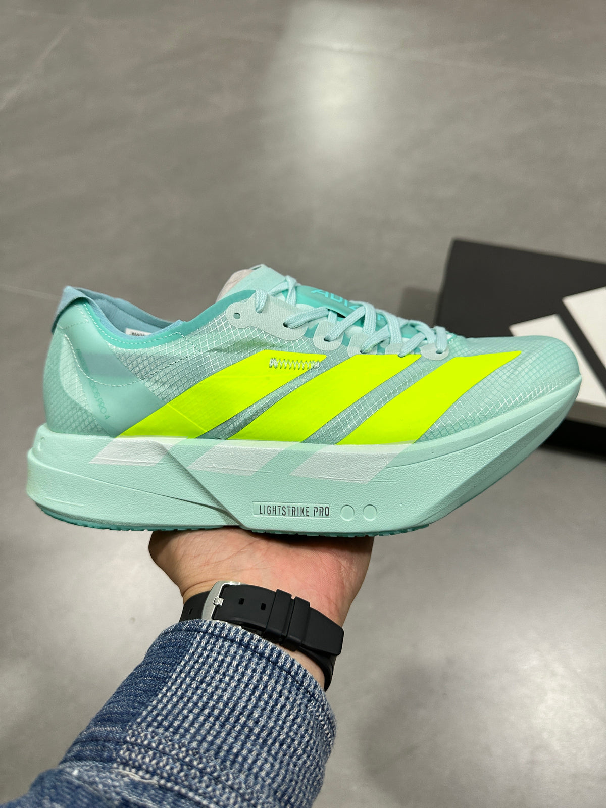 Nike Lightstrike Pro Running Shoes, in Mint Green and Volt - product image from the listing.
