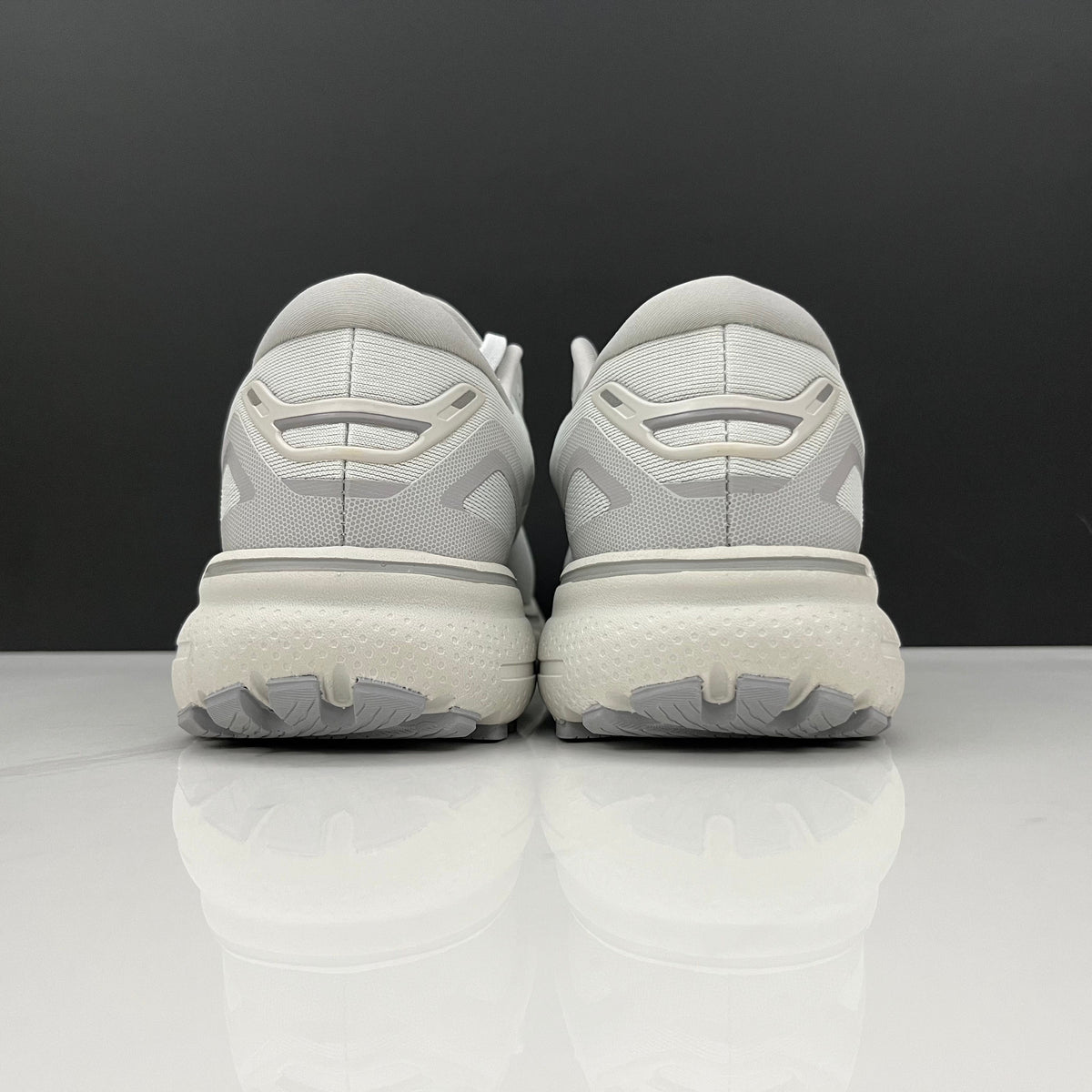White and Grey Brooks Ghost 15 Running Shoes - product image from the listing.