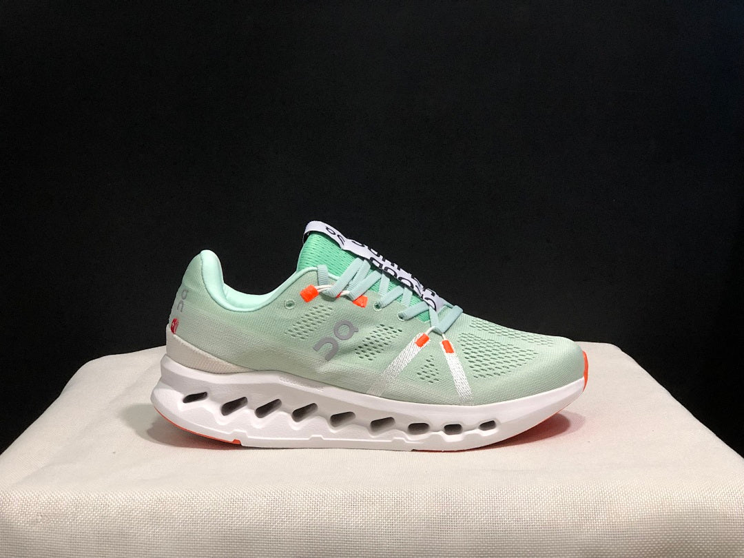 Pale Green and White On Cloudsurfer Sneakers - product image from the listing.