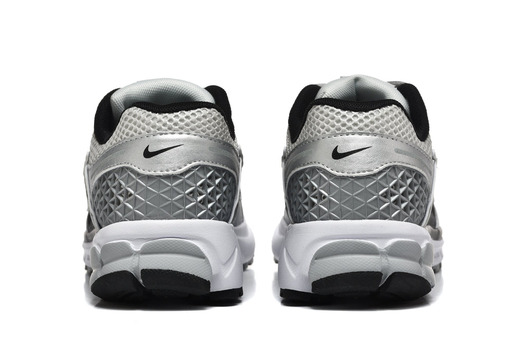 Nike Silver and Black Mesh Trainers - product image from the listing.