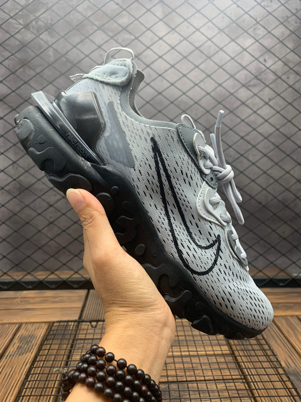 Black and Grey Nike React Vision Sneakers - product image from the listing.