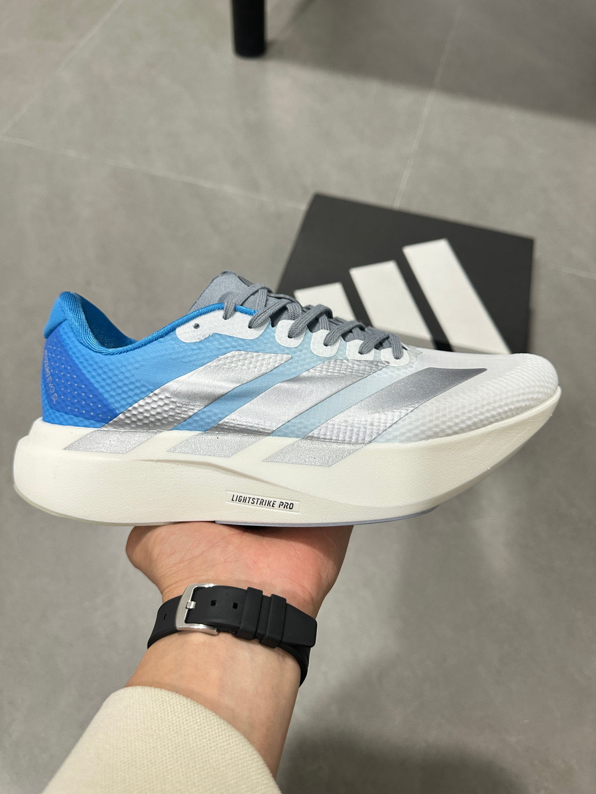 adidas Adizero EVO SL Running Shoes in White Blue JR2027 - product image from the listing.