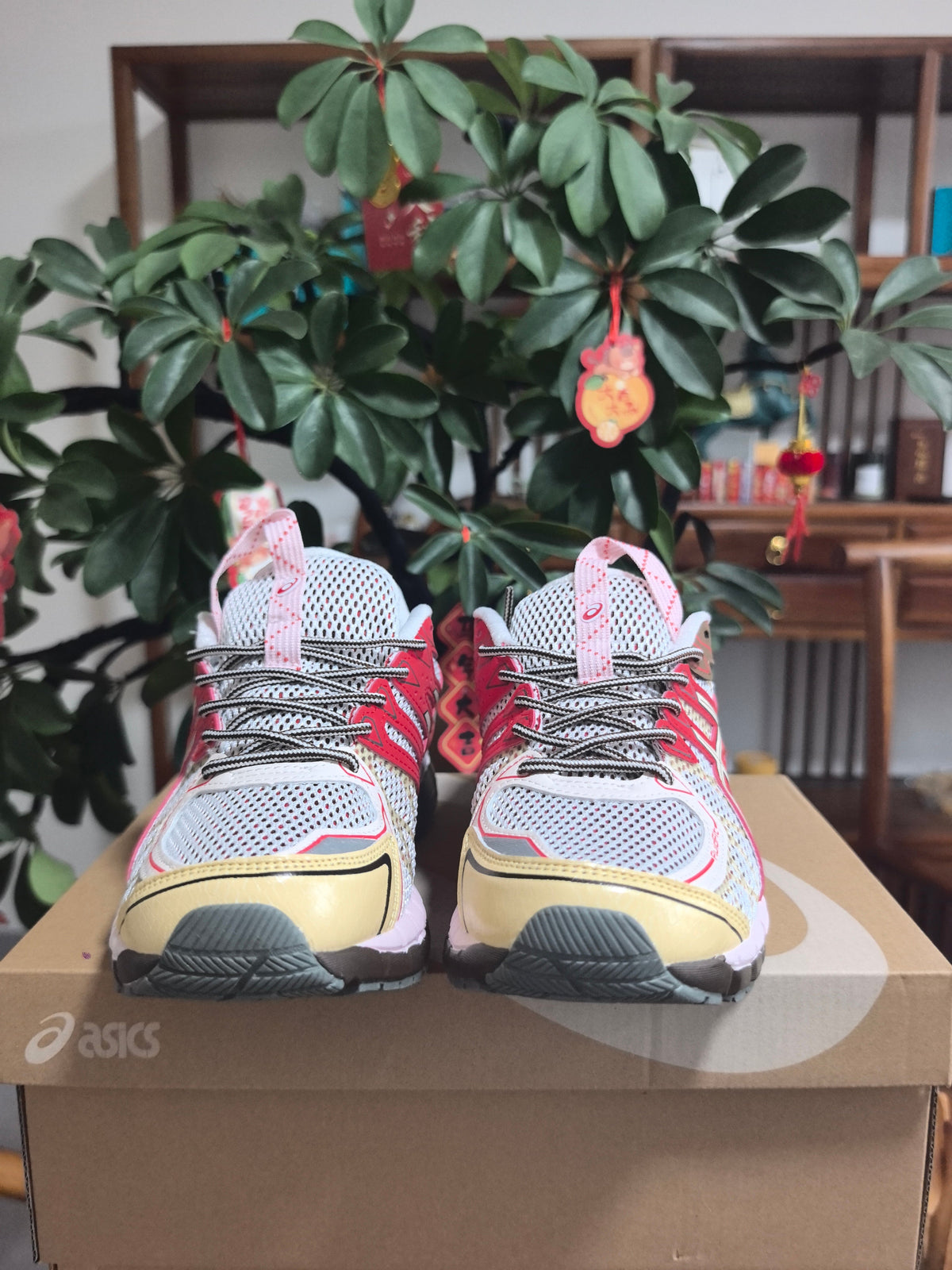 ASICS Gel-Kayano 22 Running Sneakers in White and Red - product image from the listing.