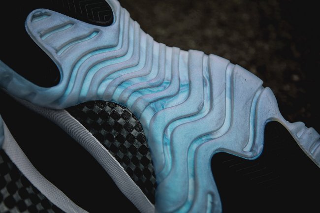 White and Black Air Jordan 11 Iridescent Sneakers - product image from the listing.