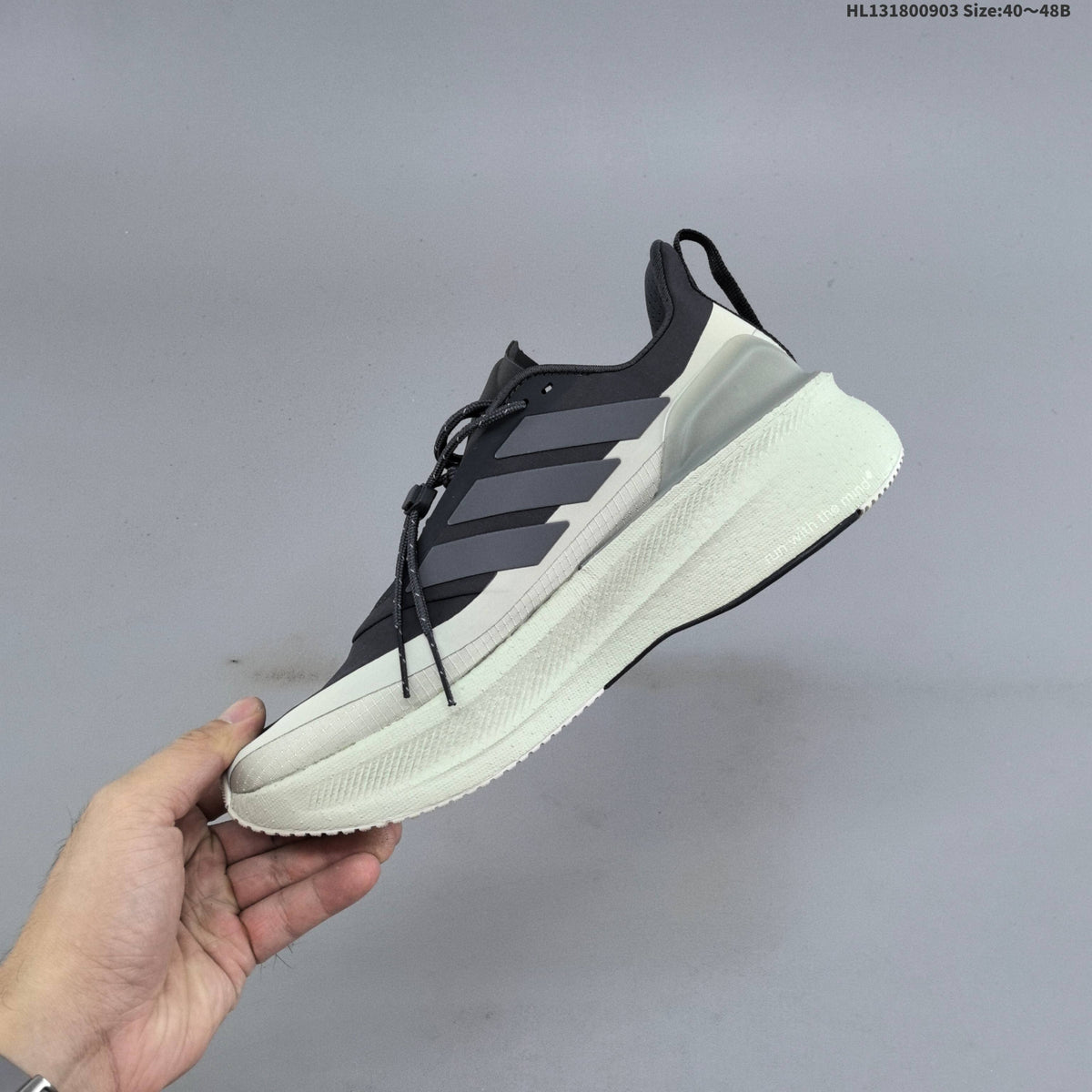 Adidas Ultraboost 5 Running Shoes, in Charcoal and Cream - product image from the listing.