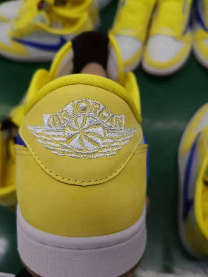 Jordan 1 Low Sneakers in Canary Yellow and Blue DZ4137-700 - product image from the listing.