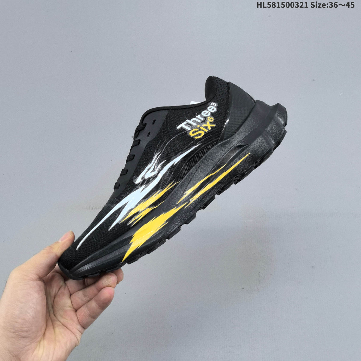 Alo Yoga Alo Runner Graphic Running Sneakers, in Black - product image from the listing.