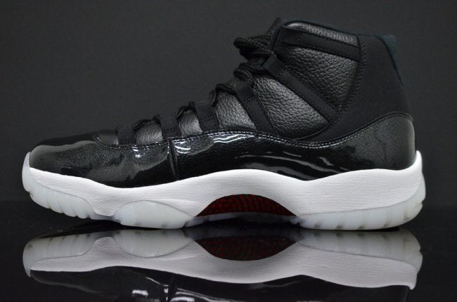 Air Jordan 11 Retro 72-10 High-Top Sneakers in Black and White - product image from the listing.