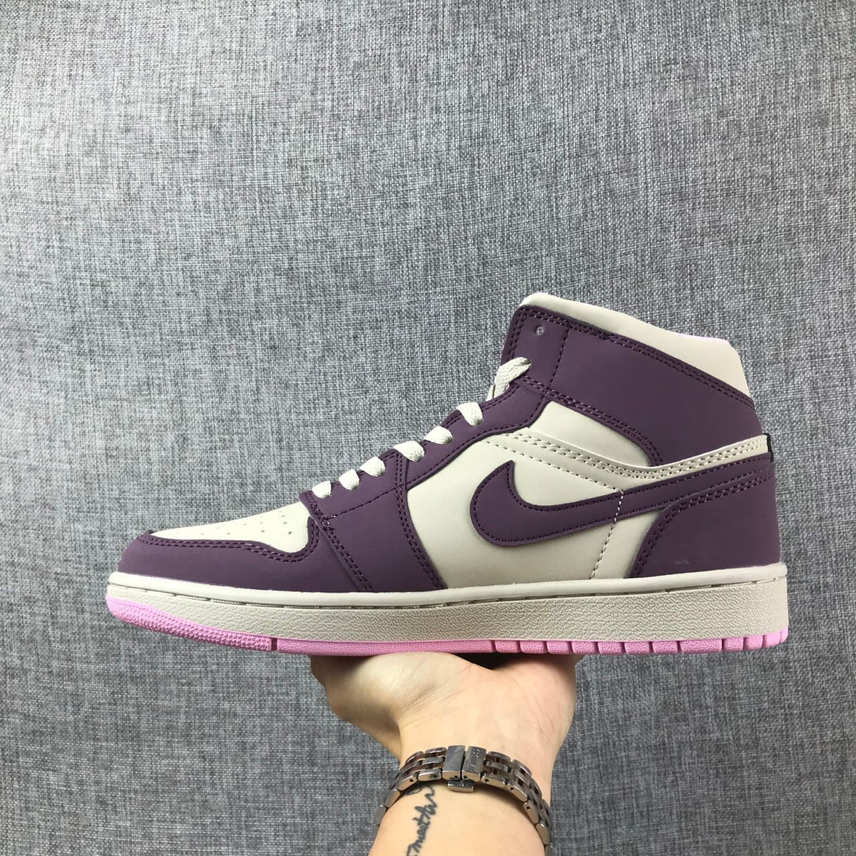 Air Jordan 1 Mid Sneakers in Pink Purple 555112-500 - product image from the listing.