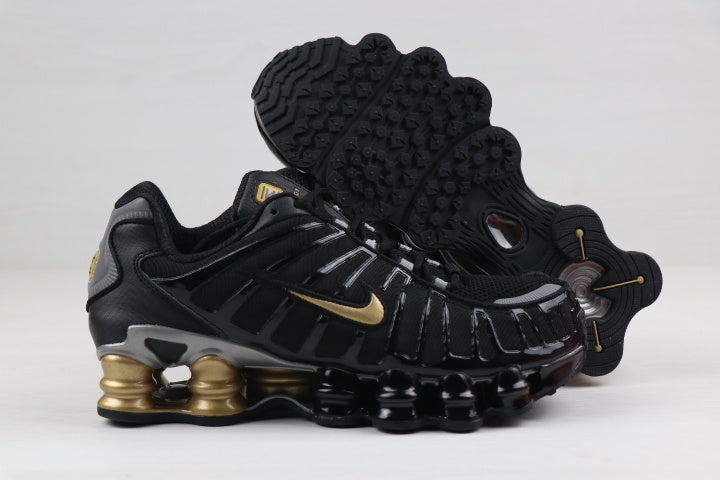 Black and Gold Nike Shox TL Sneakers - product image from the listing.