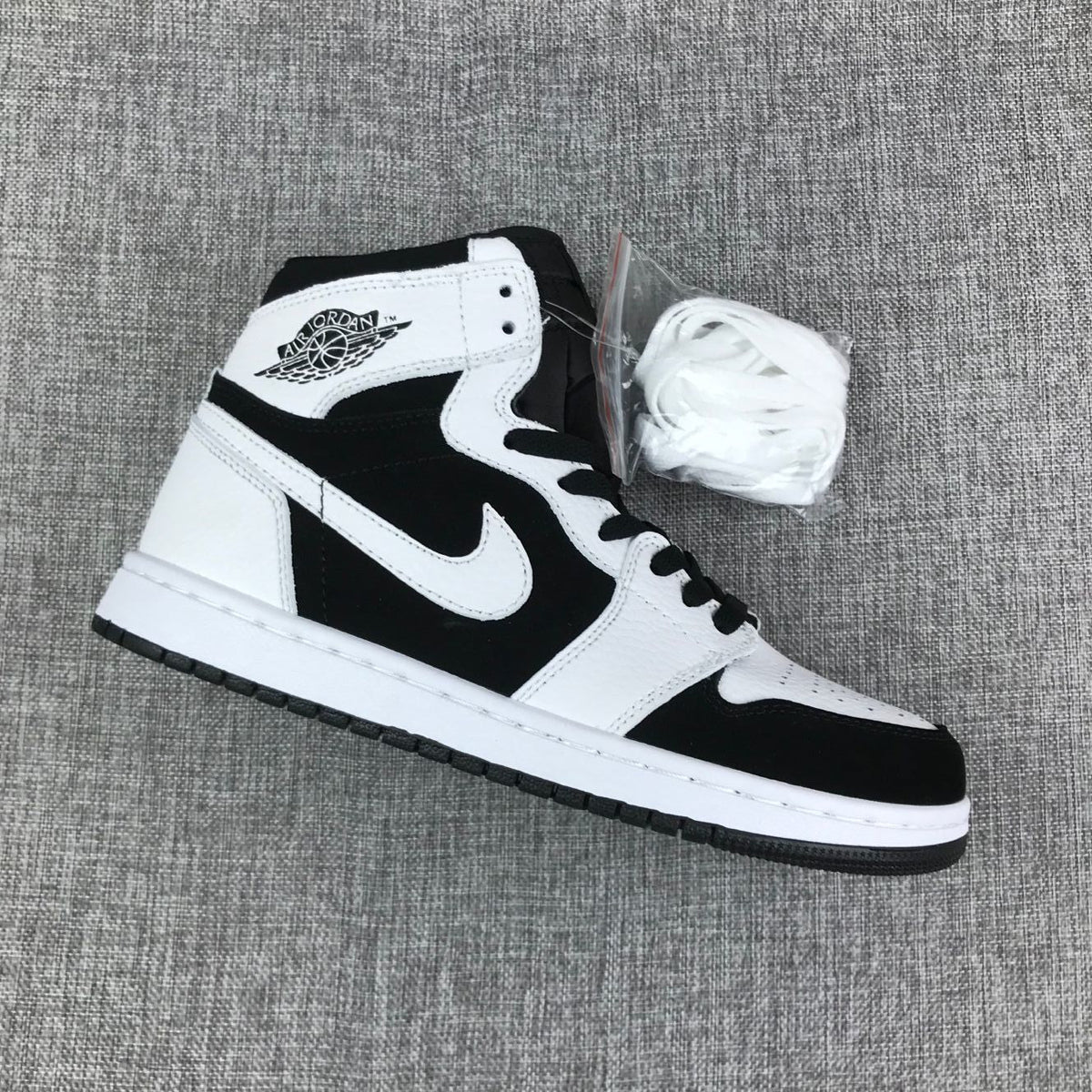 Air Jordan 1 High Sneakers in Black and White 554724-113 - product image from the listing.