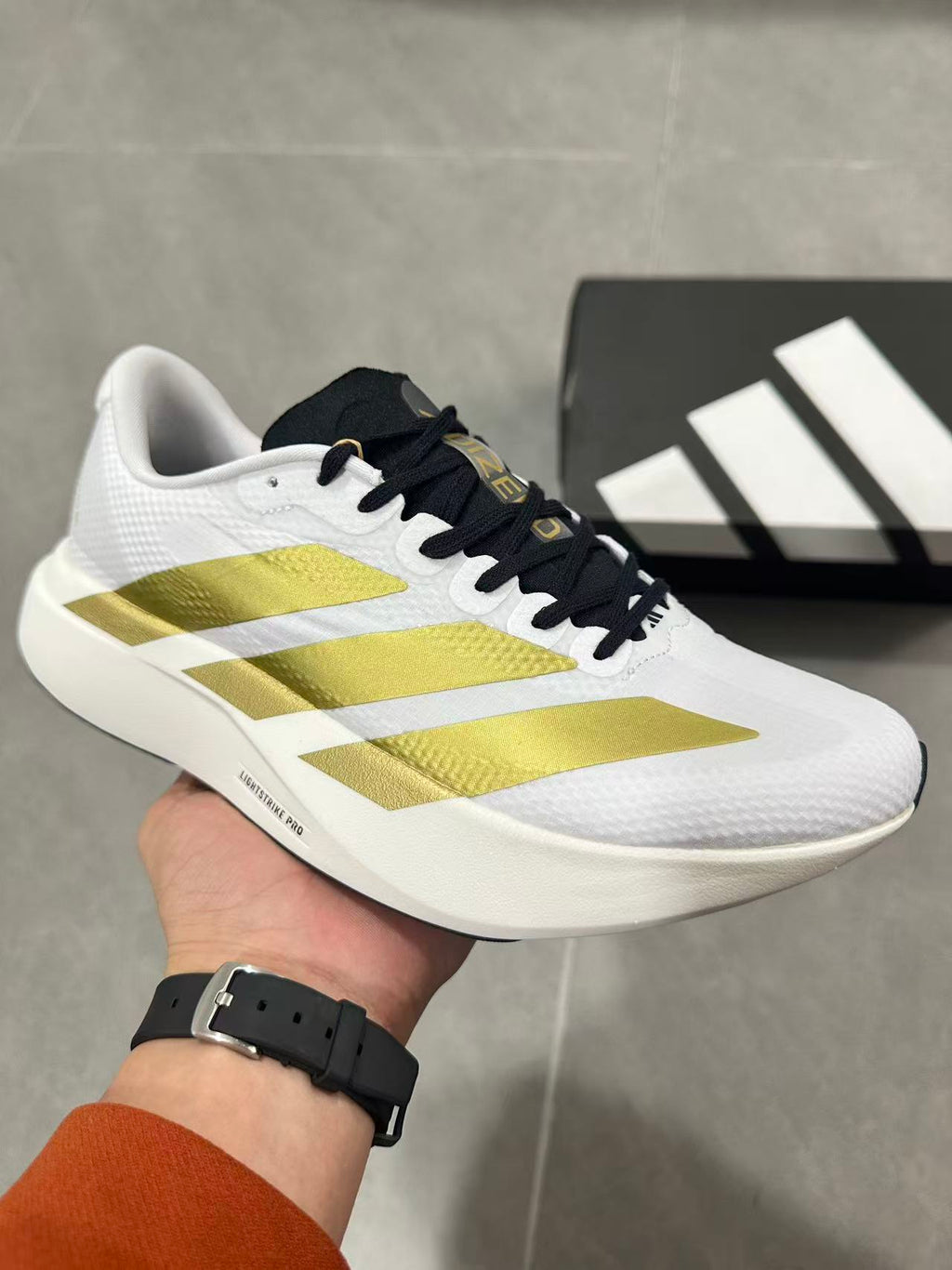 Adidas Lightstrike Pro Running Shoes in White Gold JQ4441 - product image from the listing.