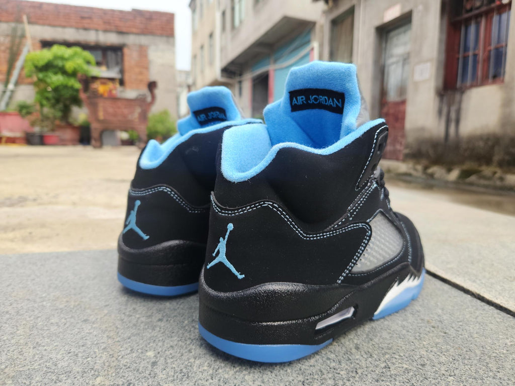Air Jordan 5 in Black/University Blue - product image from the listing.