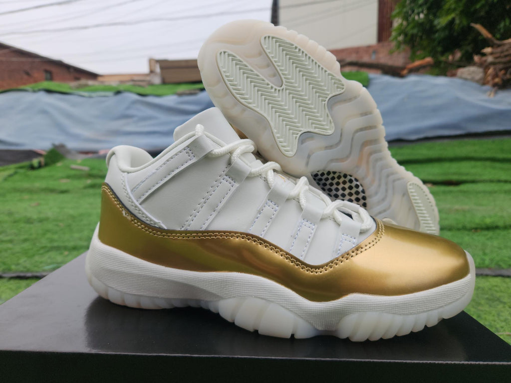 Air Jordan 11 Low in White/Gold - product image from the listing.