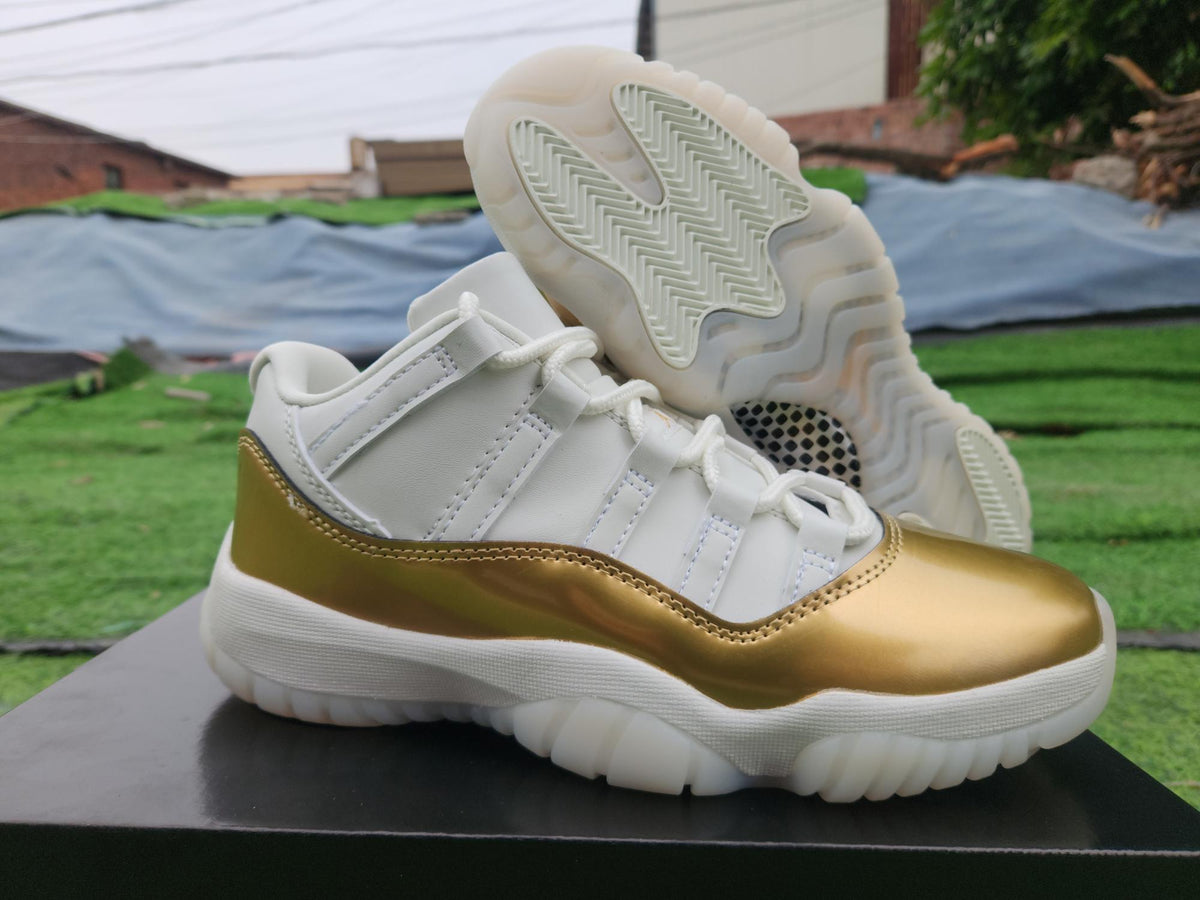 Air Jordan 11 Low in White/Gold - product image from the listing.