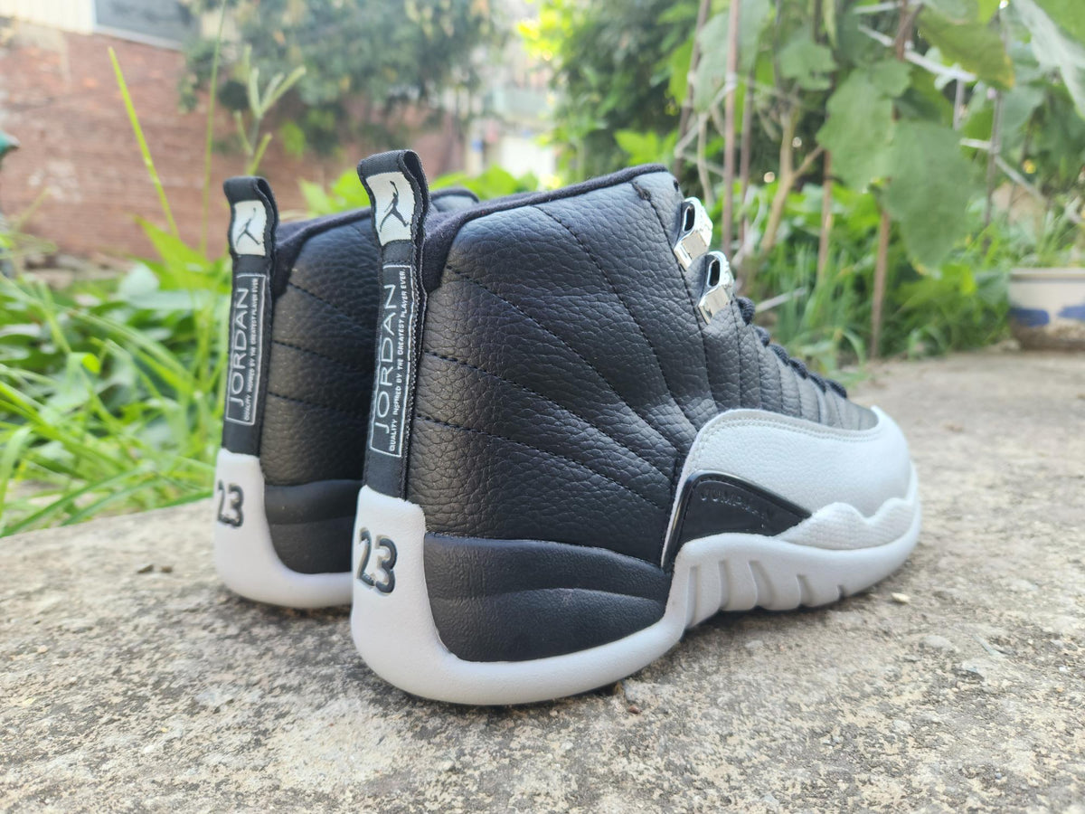 Air Jordan 12 Retro in Black/Light Grey - product image from the listing.