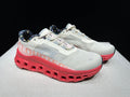 Light Gray and Coral On Cloudmonster Sneakers - product image from the listing.