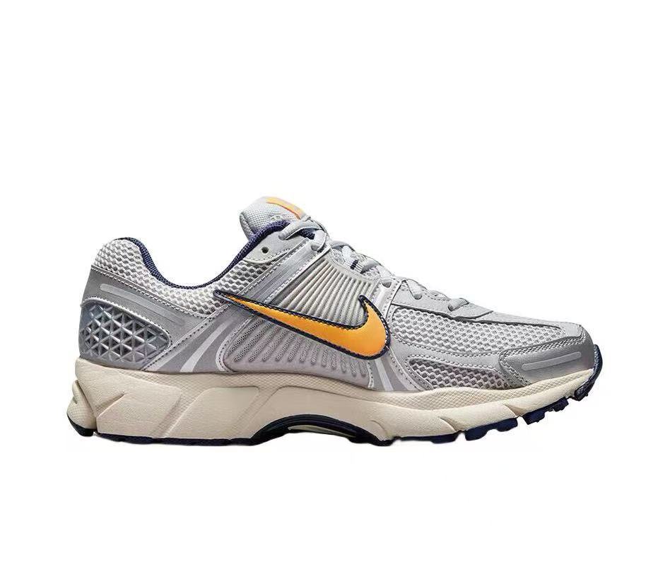Nike Zoom Vomero 5 Sneakers in Gray Orange - product image from the listing.