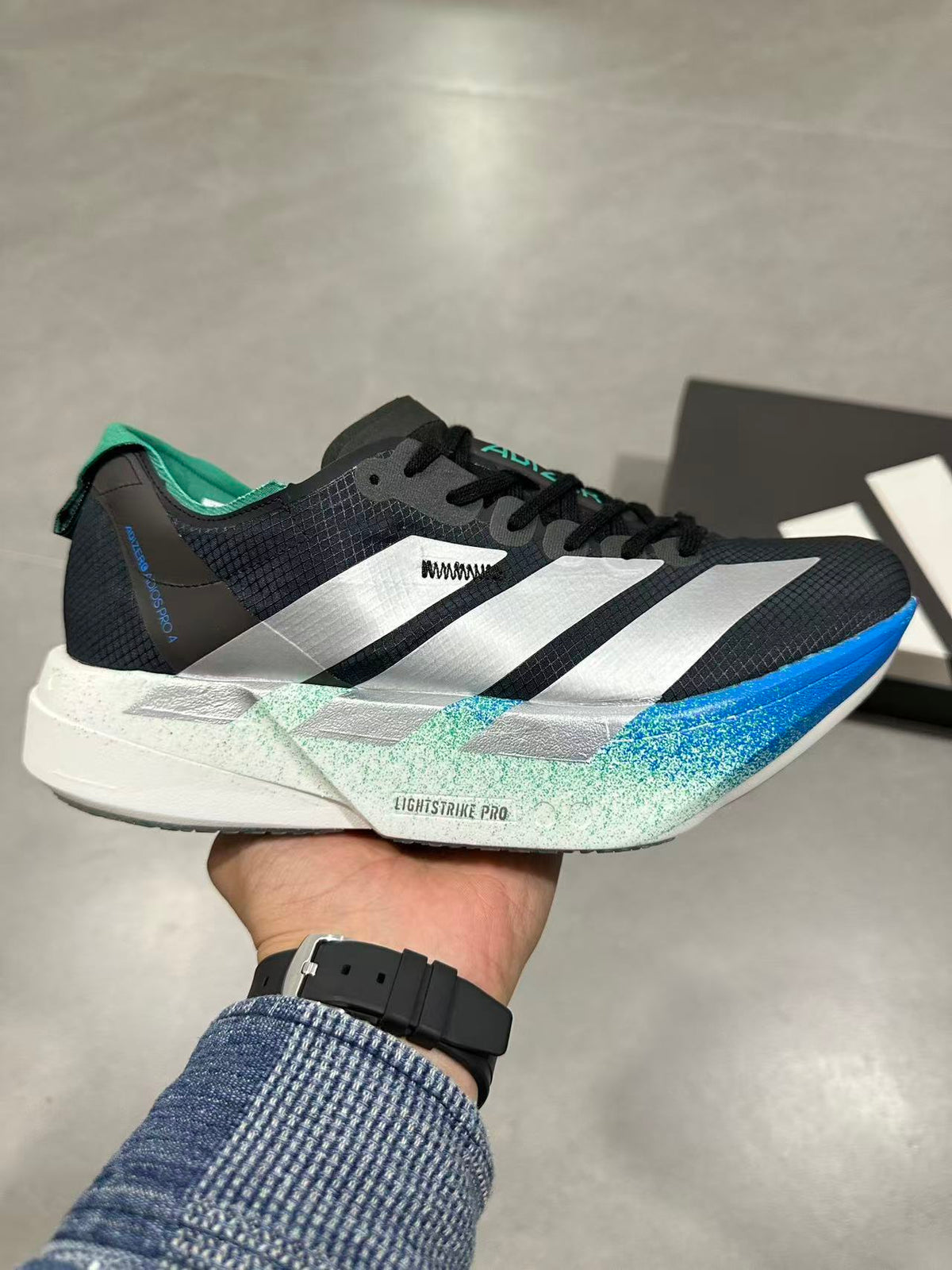 Nike Adizero Lightstrike Pro Running Shoes in Black Blue - product image from the listing.