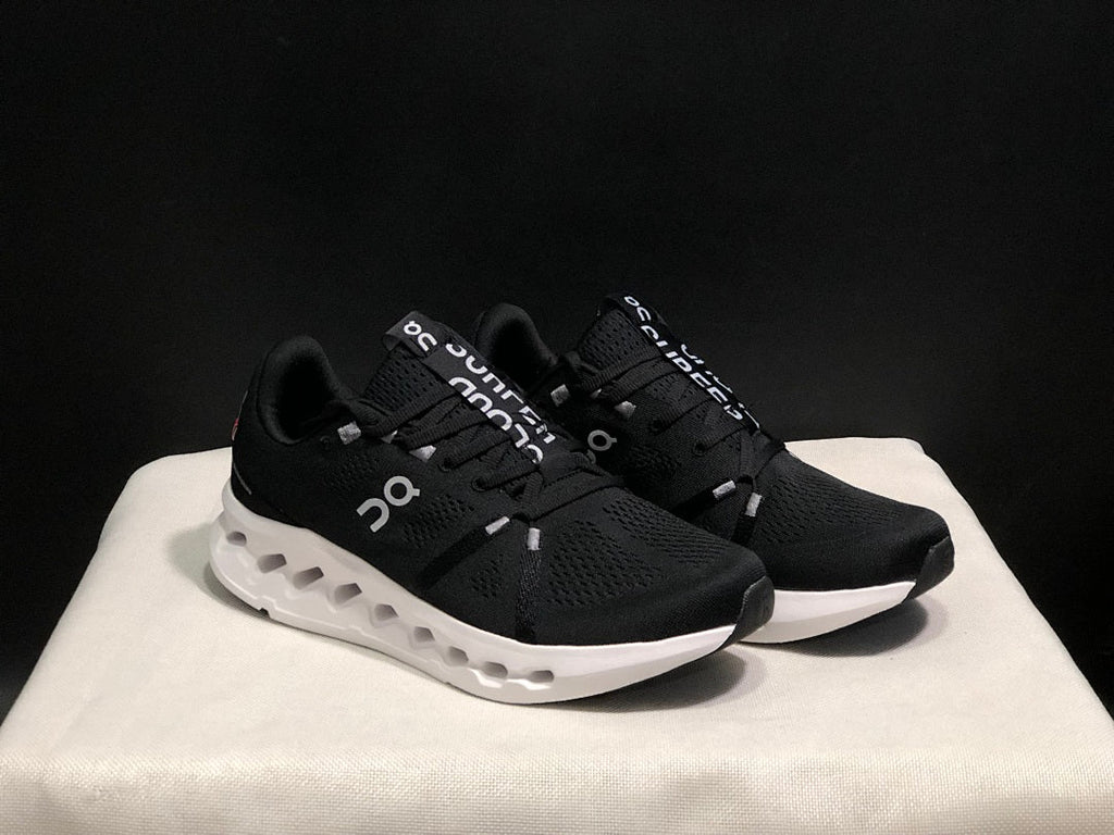 On Cloudsurfer Running Shoes in Black and White - product image from the listing.