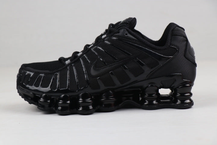Black and Gold Nike Shox TL Sneakers - product image from the listing.
