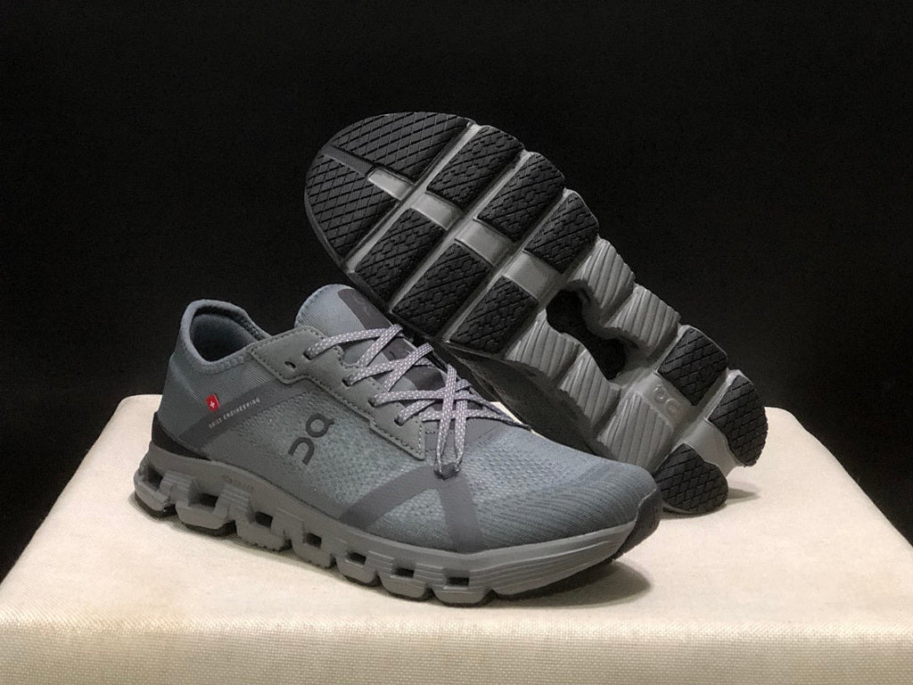 Gray and Black On Cloud X 4 AD Sneakers - product image from the listing.