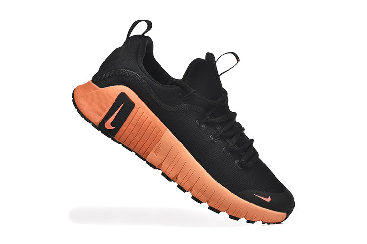 Nike Free TR Fitness Sneakers in Black and Coral - product image from the listing.