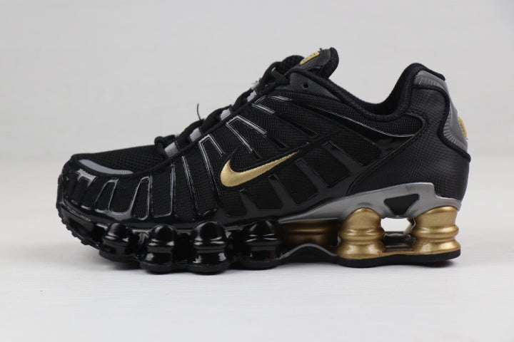Black and Gold Nike Shox TL Sneakers - product image from the listing.